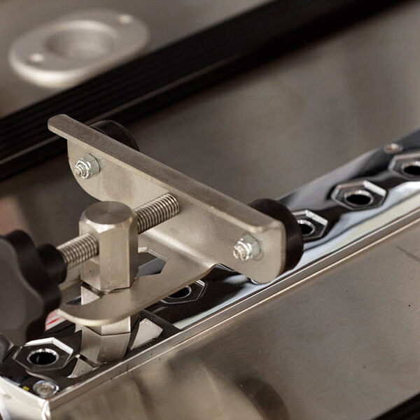 AME-SS150XLC bier pin plate mounting locations — American Mortuary Equipment oversize single-deck with two bier pin plates and four casket rollers for full-size cargo van transport