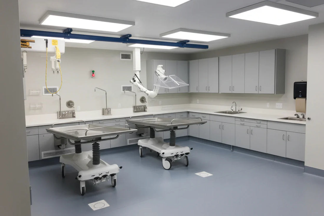 Heavy-duty 1000lb capacity bariatric embalming table with reinforced hydraulic base and extra-wide stainless steel top for 2026 OSHA compliance.