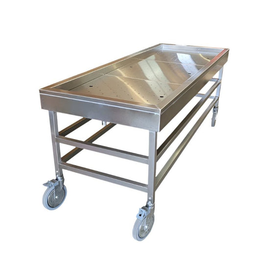 Hydraulic embalming table