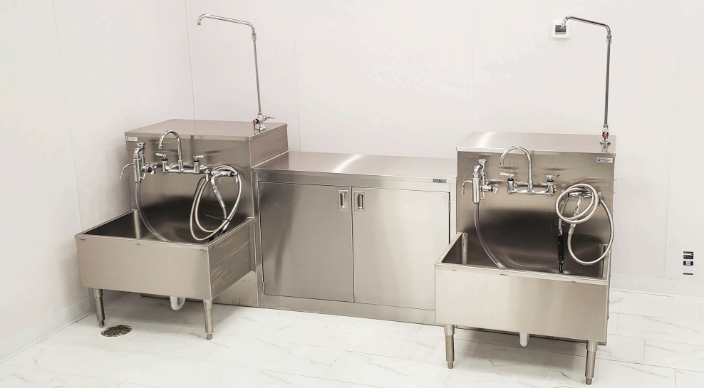 Stainless steel embalming station with integrated water control designed for professional funeral home preparation rooms in 2026