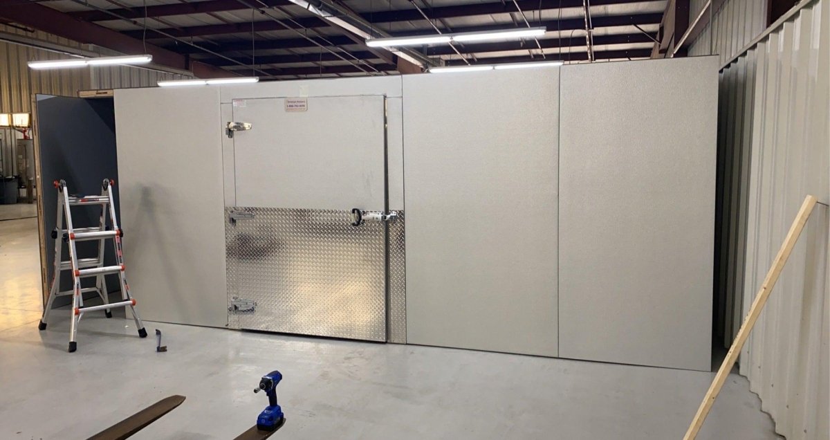 Heavy-duty self-closing door and hardware on a 16x20 walk-in mortuary cooler