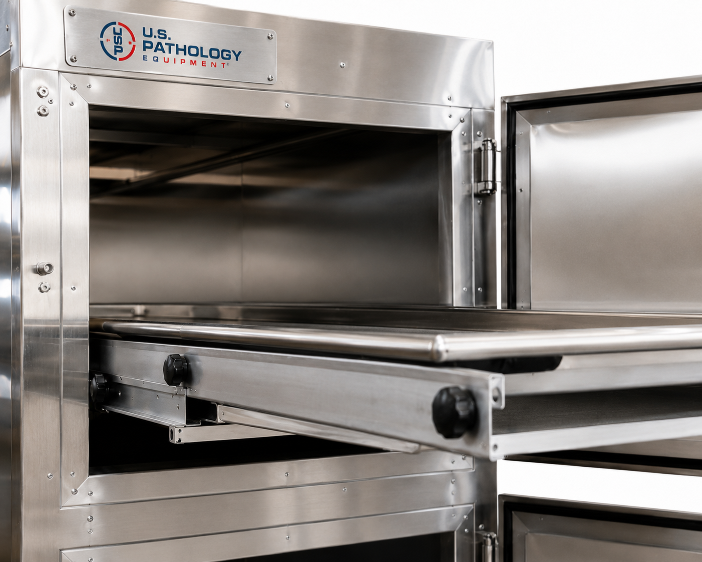 Vertical vault-style morgue cooler, stacked individual-bay stainless cadaver storage — American Mortuary Coolers