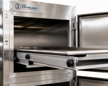 Vertical vault-style morgue cooler, stacked individual-bay stainless cadaver storage — American Mortuary Coolers