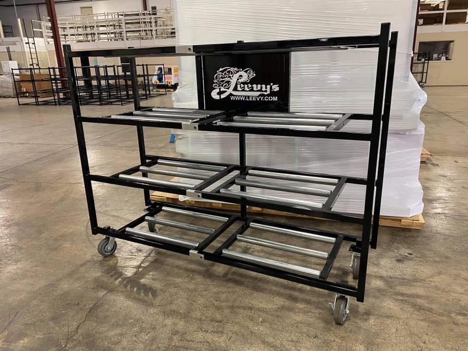 Multiple Model 2000-4TSL mortuary racks in a large mortuary cooler, illustrating high-volume cadaver storage.