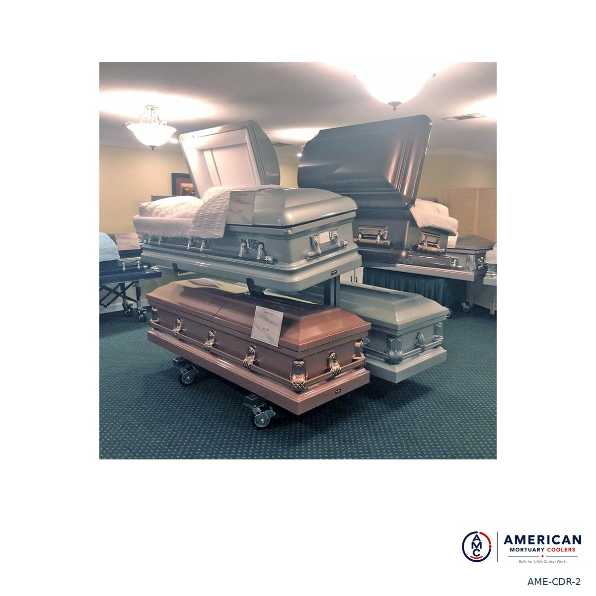AME two-tier casket display racks in a funeral home showroom; caskets not included