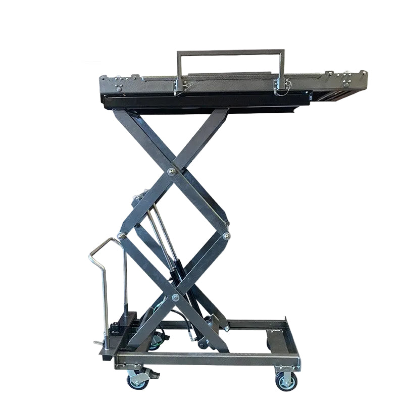 Foot-pump mortuary body lift in use at crematory — manual hydraulic HD scissor lift loading cadaver onto mortuary rack