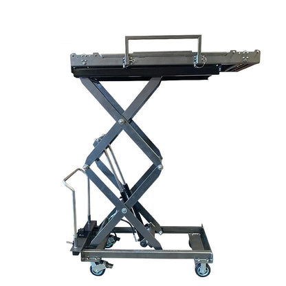 Foot-pump mortuary body lift in use at crematory — manual hydraulic HD scissor lift loading cadaver onto mortuary rack