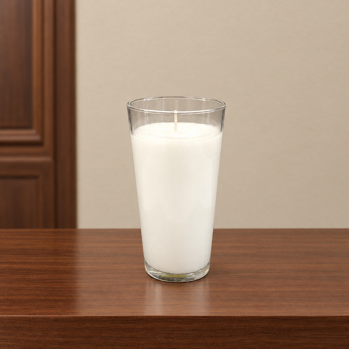 FS1 clear glass mortuary candle shown open with white wax and unlit wick