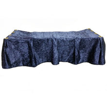 Navy blue crushed-velvet church truck drape with 12-pleat skirt covering a casket church truck