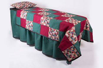 ID viewing system with pillowcase and skirt in red and green patchwork with waterproof base