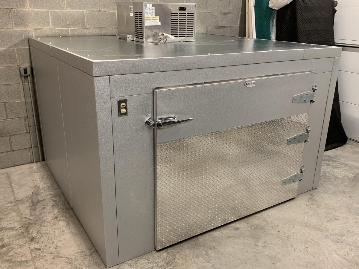 “Interior view of triple cot roll-in mortuary cooler showing spacious 3-body capacity and stainless steel finish.”